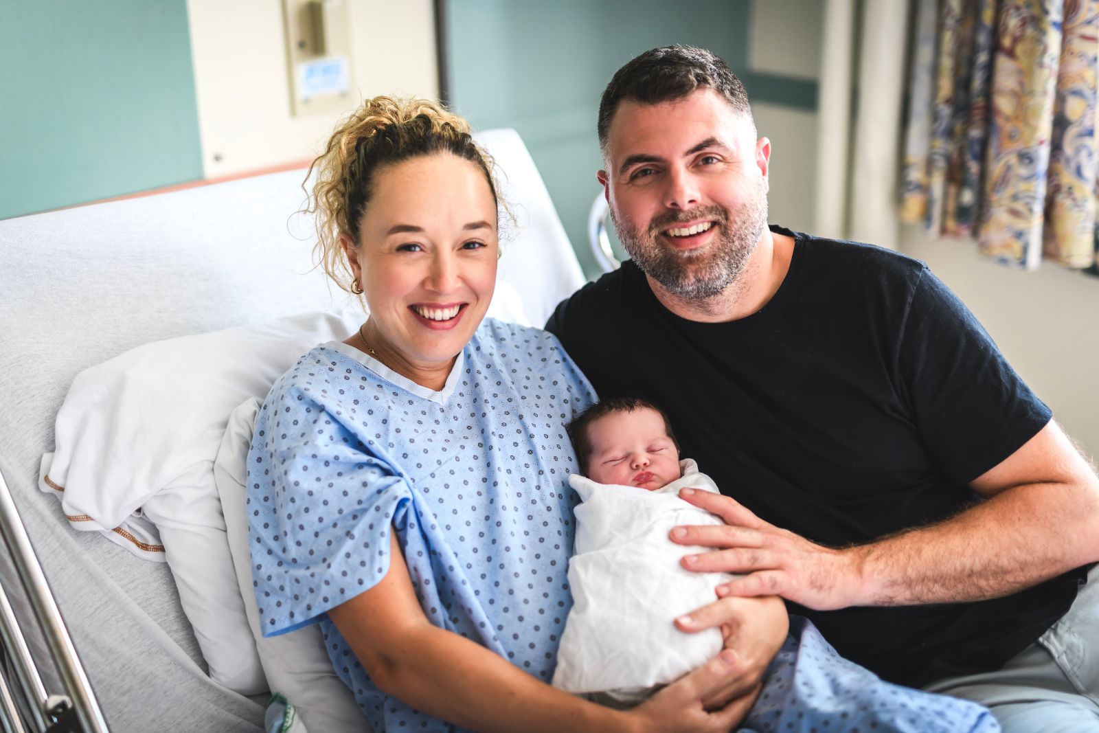 New born baby boy with the family in the hospital room